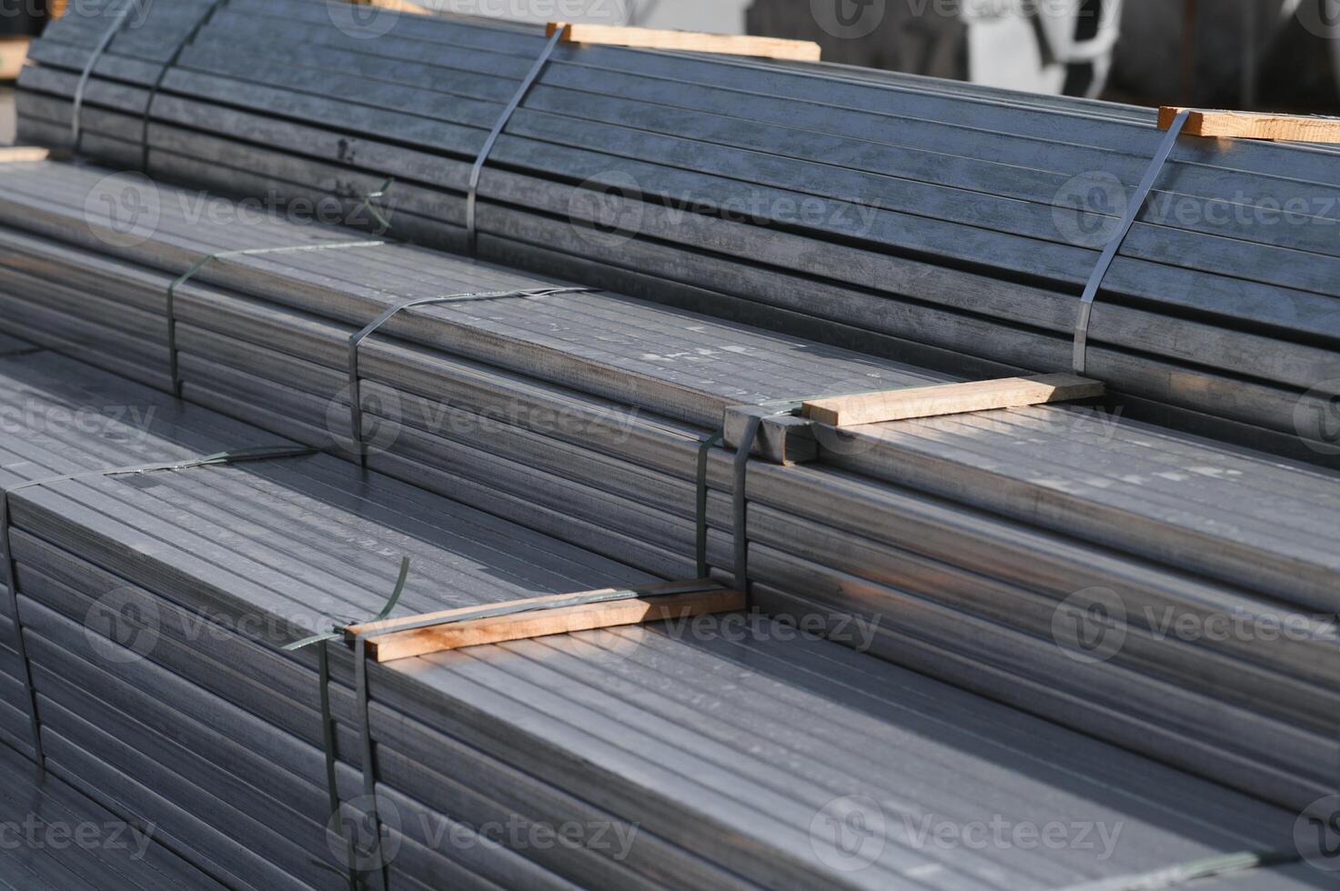 Stack of rolled metal products, perspective view of steel pipes of rectangular cross-section photo