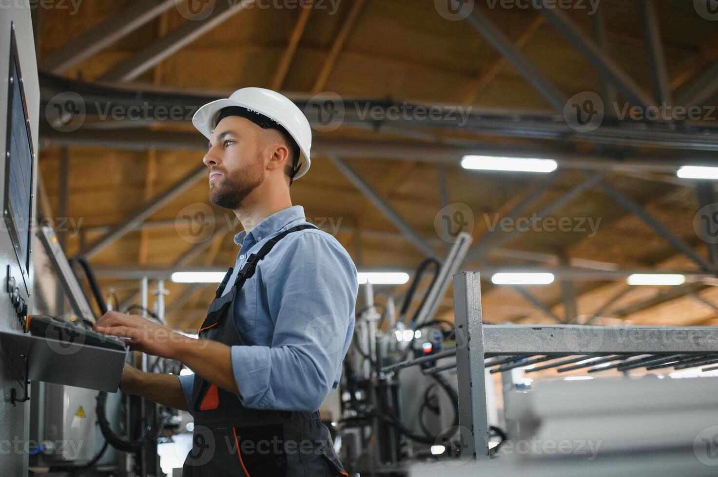 Smart factory worker or engineer do machine job in manufacturing workshop . Industry and engineering concept . photo