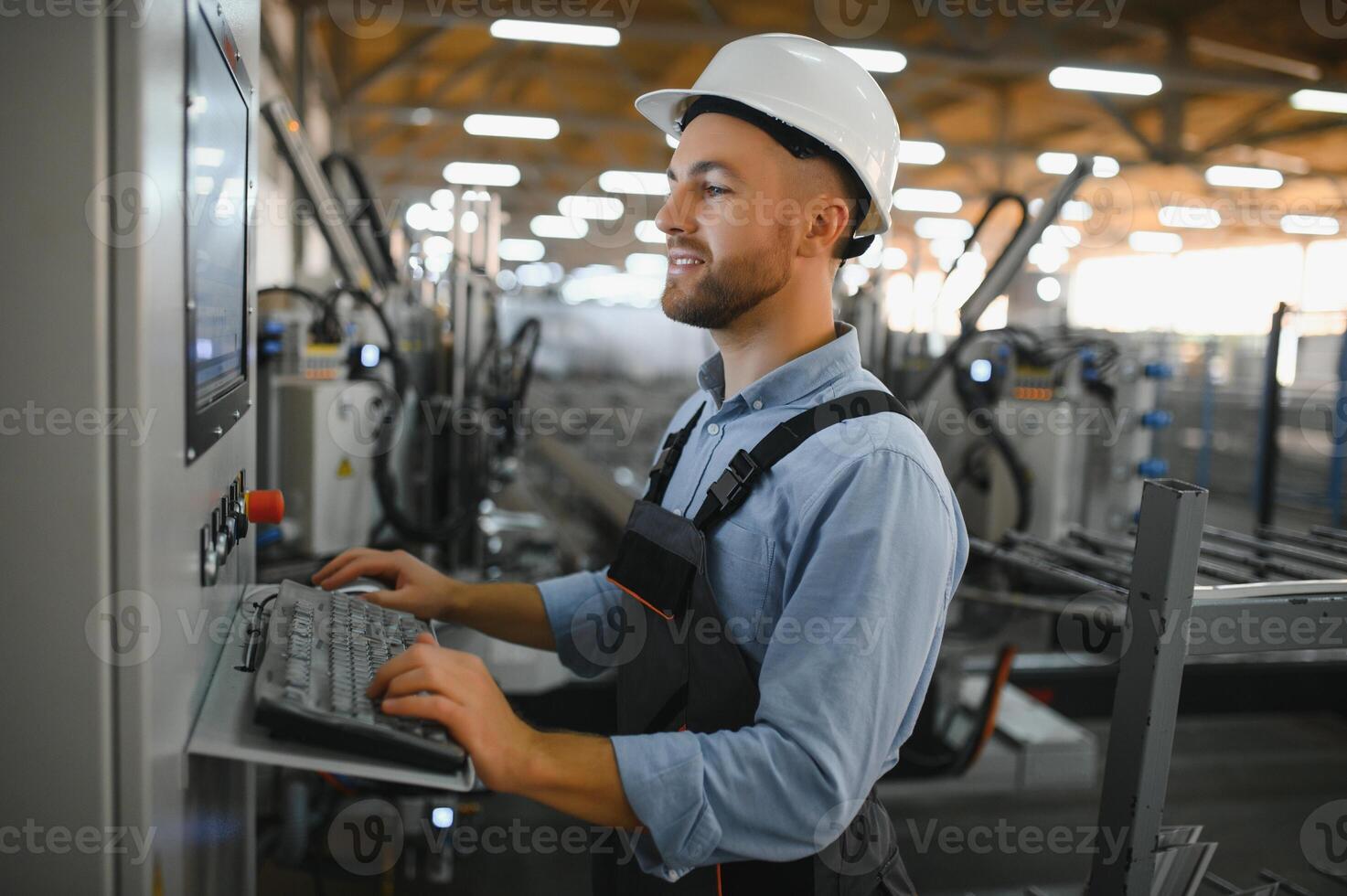 Factory for aluminum and PVC windows and doors production. Manual worker assembling PVC windows and doors. photo