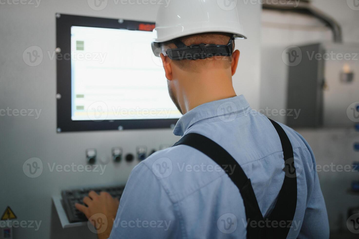 Factory worker. Man working on the production line. photo