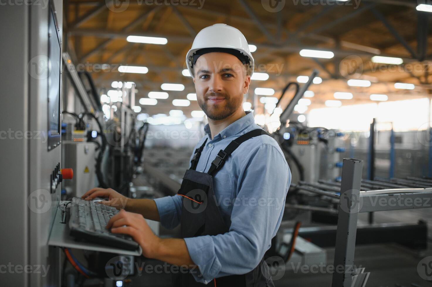 Factory worker. Man working on the production line. photo