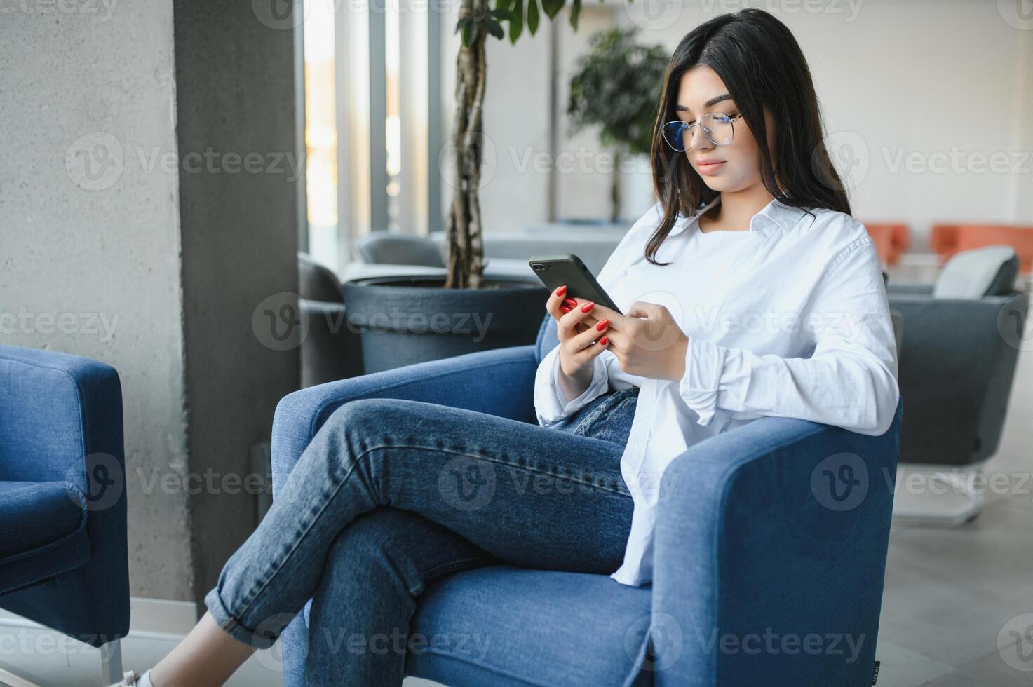 Beautiful Caucasian woman dreaming about something while sitting with portable net-book in modern cafe bar, young charming female freelancer thinking about new ideas during work on laptop computer photo