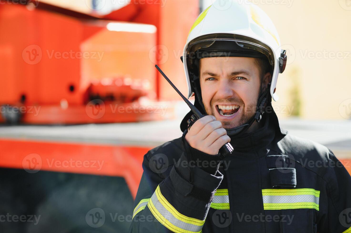 Photo of fireman with gas mask and helmet near fire engine