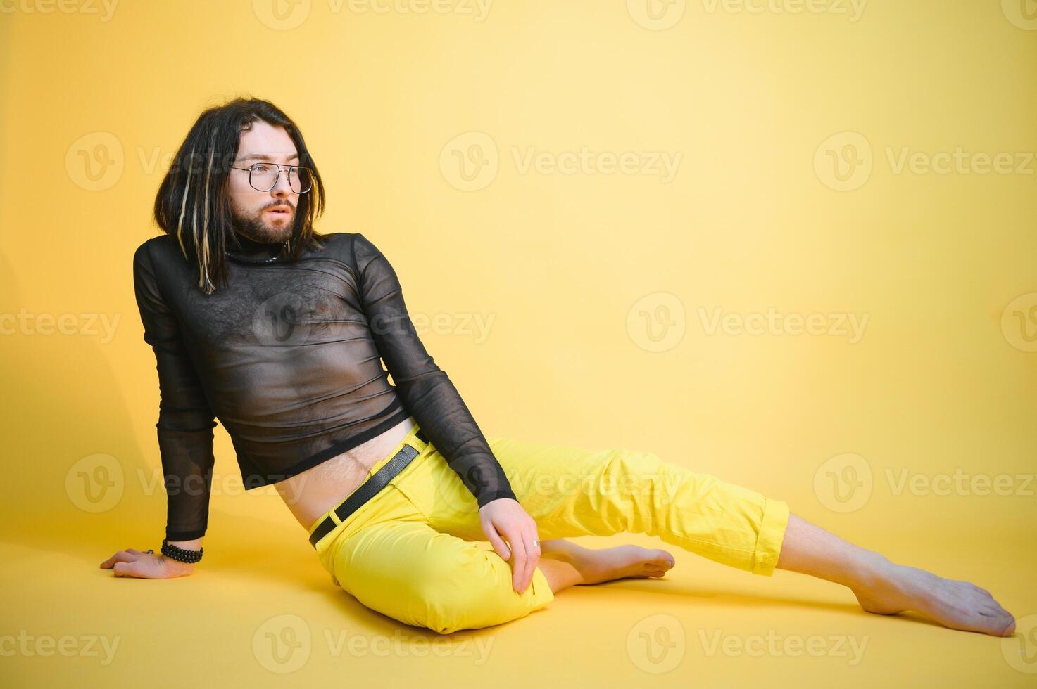 Portrait of a gay man on a colored background. Gender equality. The concept of the LGBT community. Equality. photo