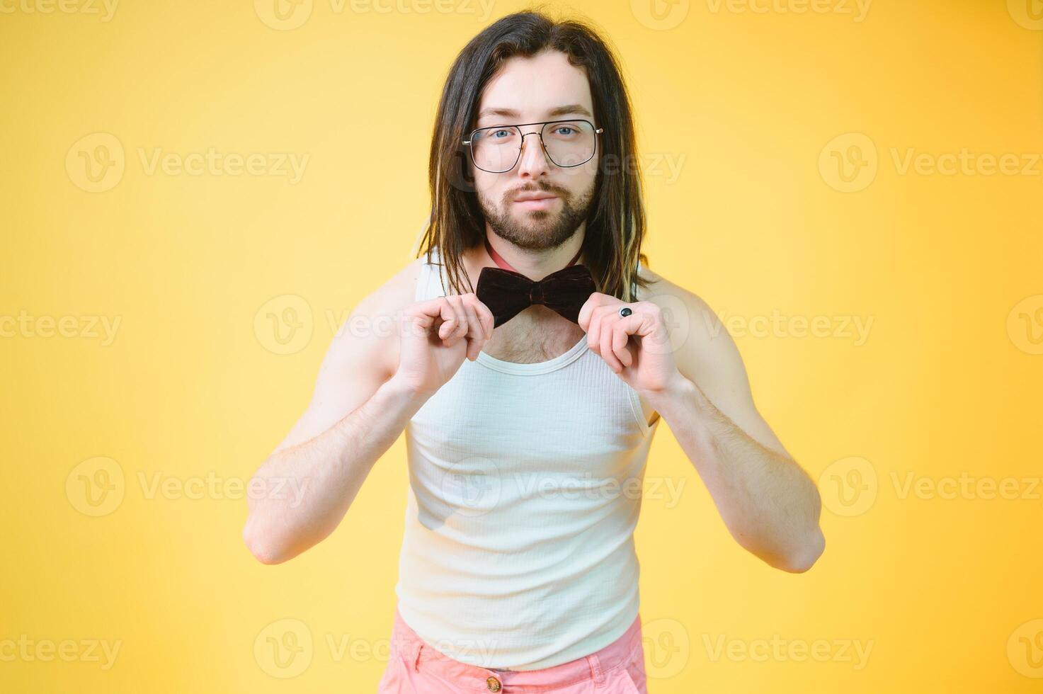 Gay man on a colored background in the studio. The concept of the LGBTQ community. Equality. photo