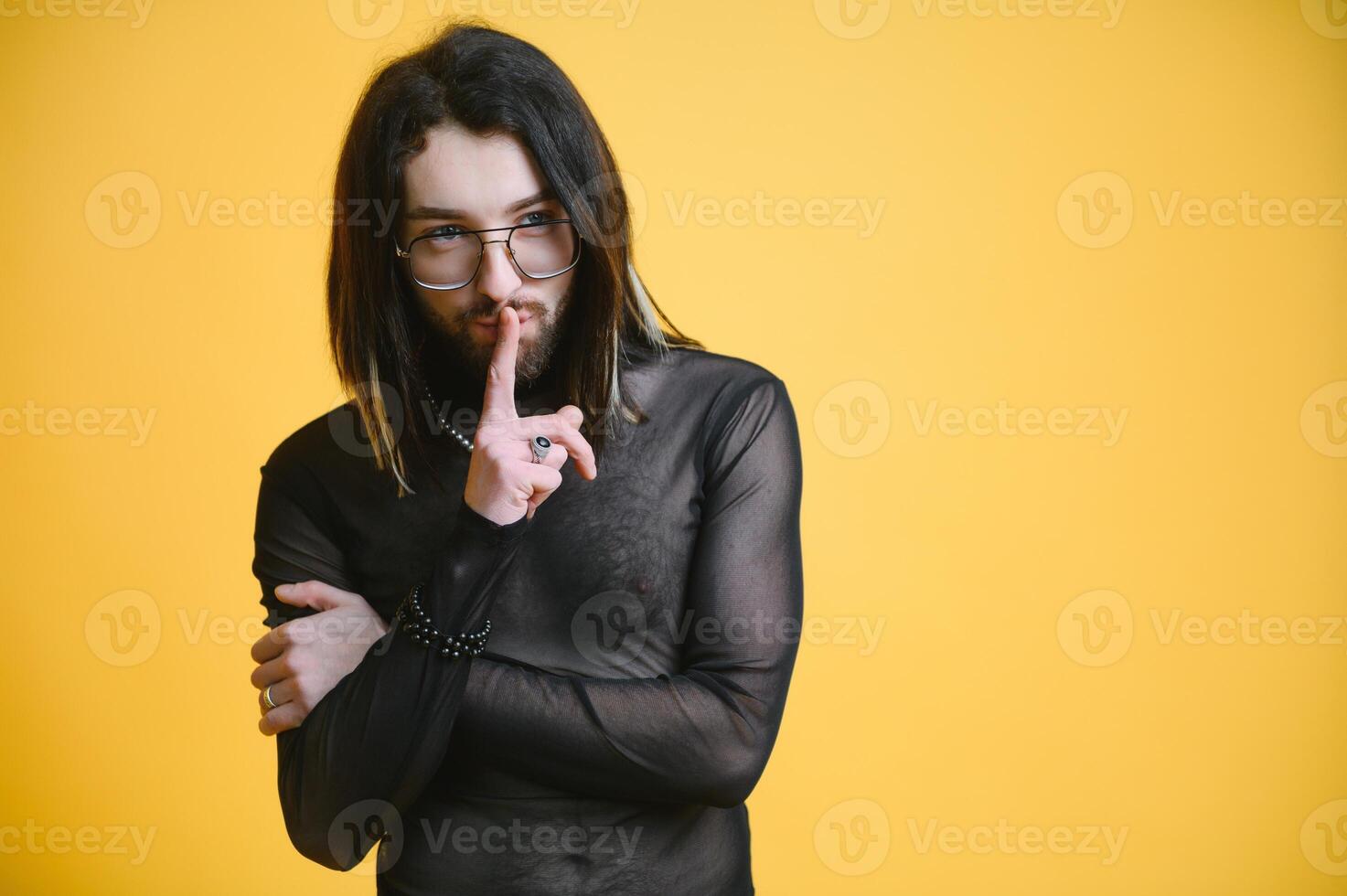 Gay man hold rainbow striped flag isolated on colored background studio portrait. People lifestyle fashion lgbtq concept photo