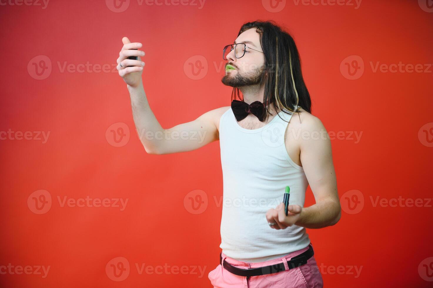 Gay man doing makeup. The concept of the LGBT community. Equality. photo
