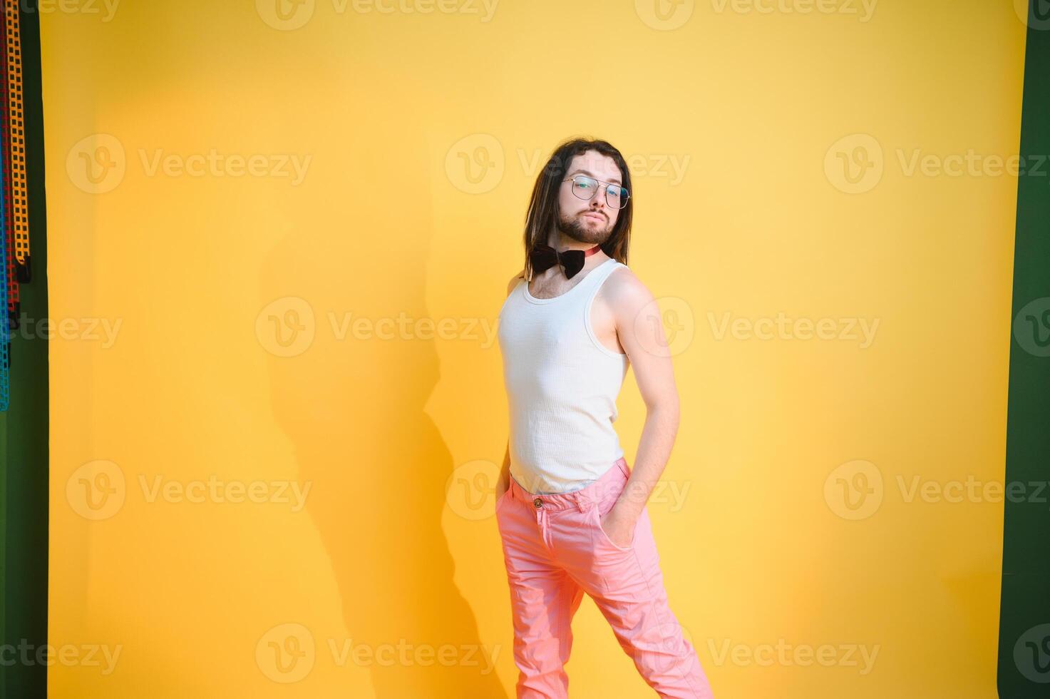 Portrait of a gay man on a colored background. Gender equality. The concept of the LGBT community. Equality. photo