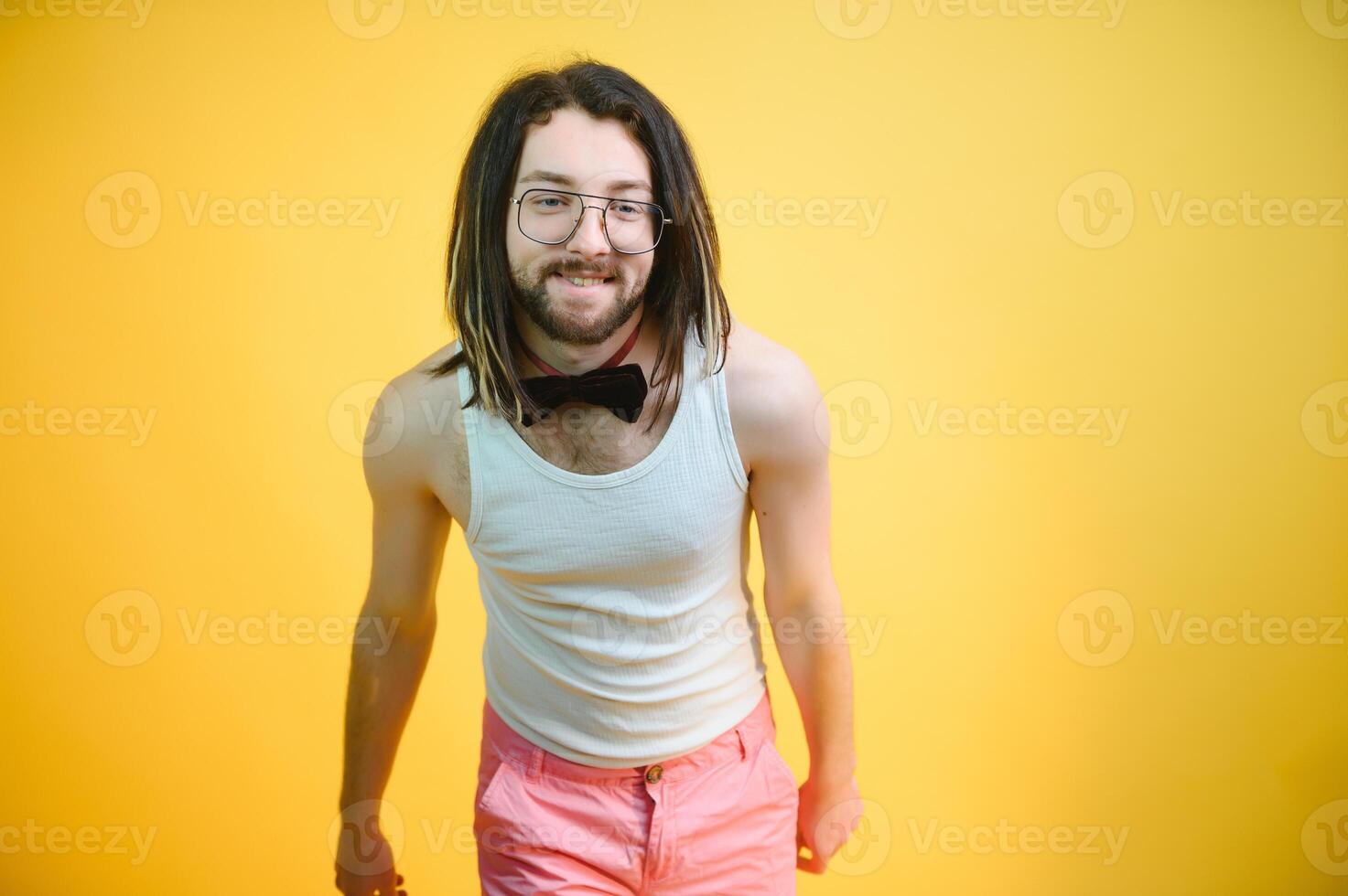 Gay man on a colored background in the studio. The concept of the LGBTQ community. Equality. photo