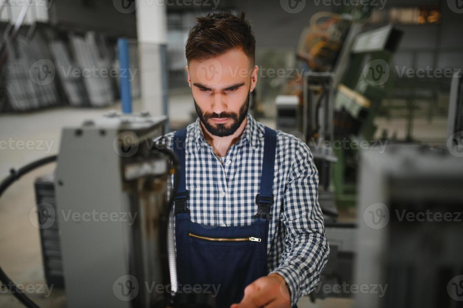 Factory worker. Man working on the production line. photo