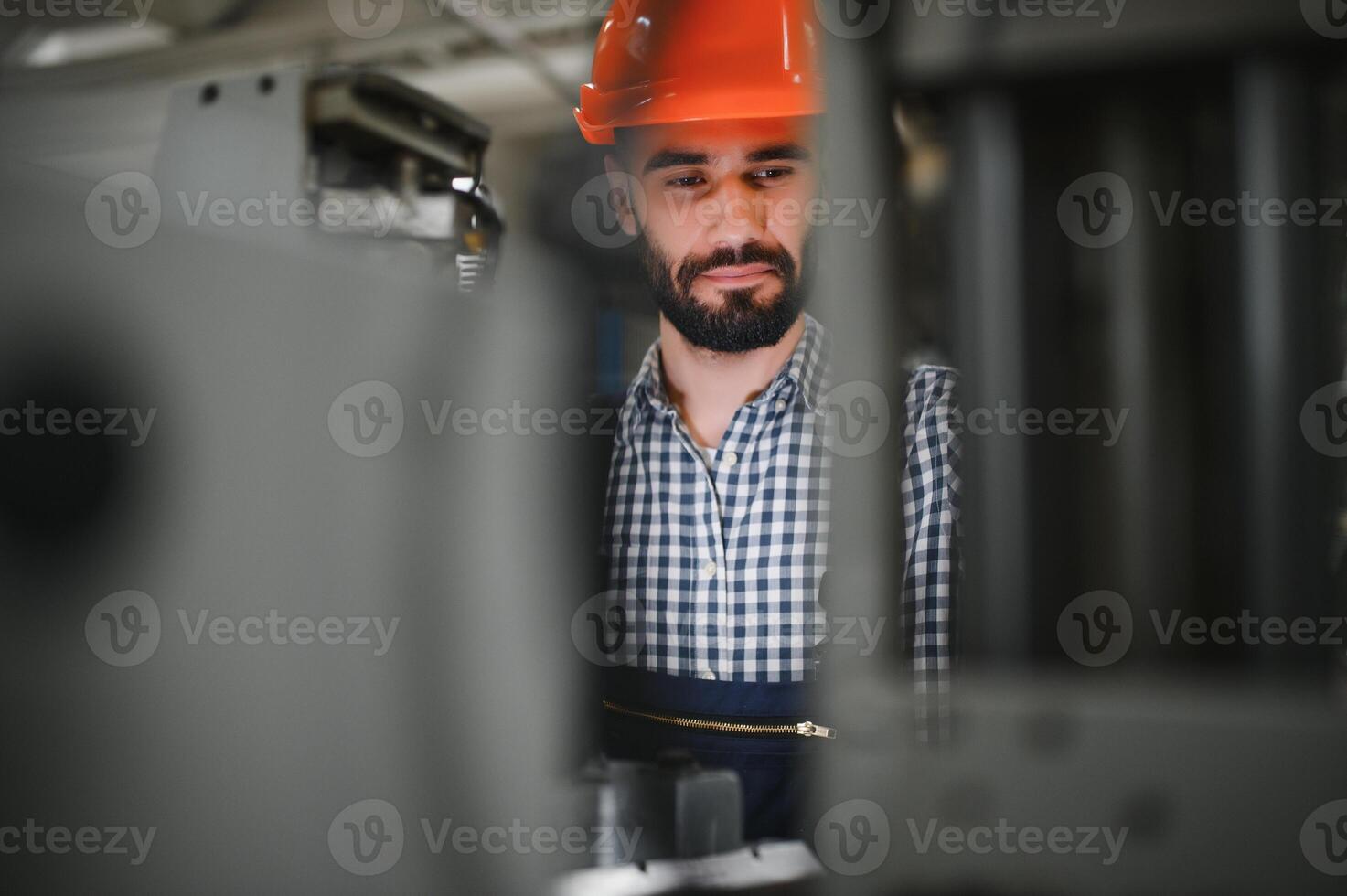 Factory worker. Man working on the production line. photo