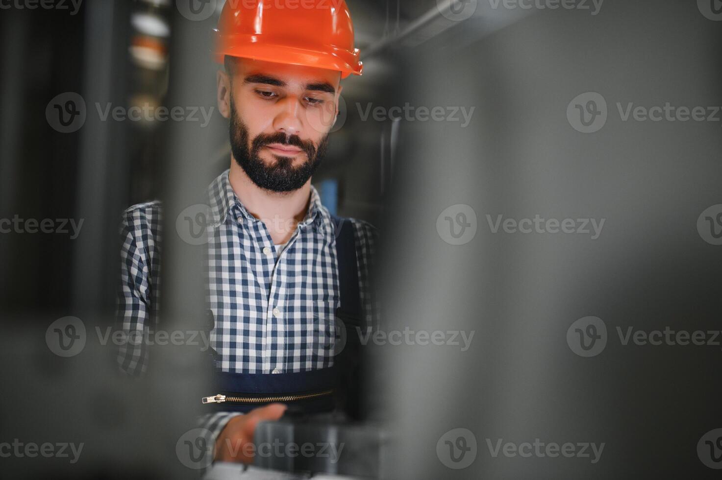 Factory worker. Man working on the production line. photo