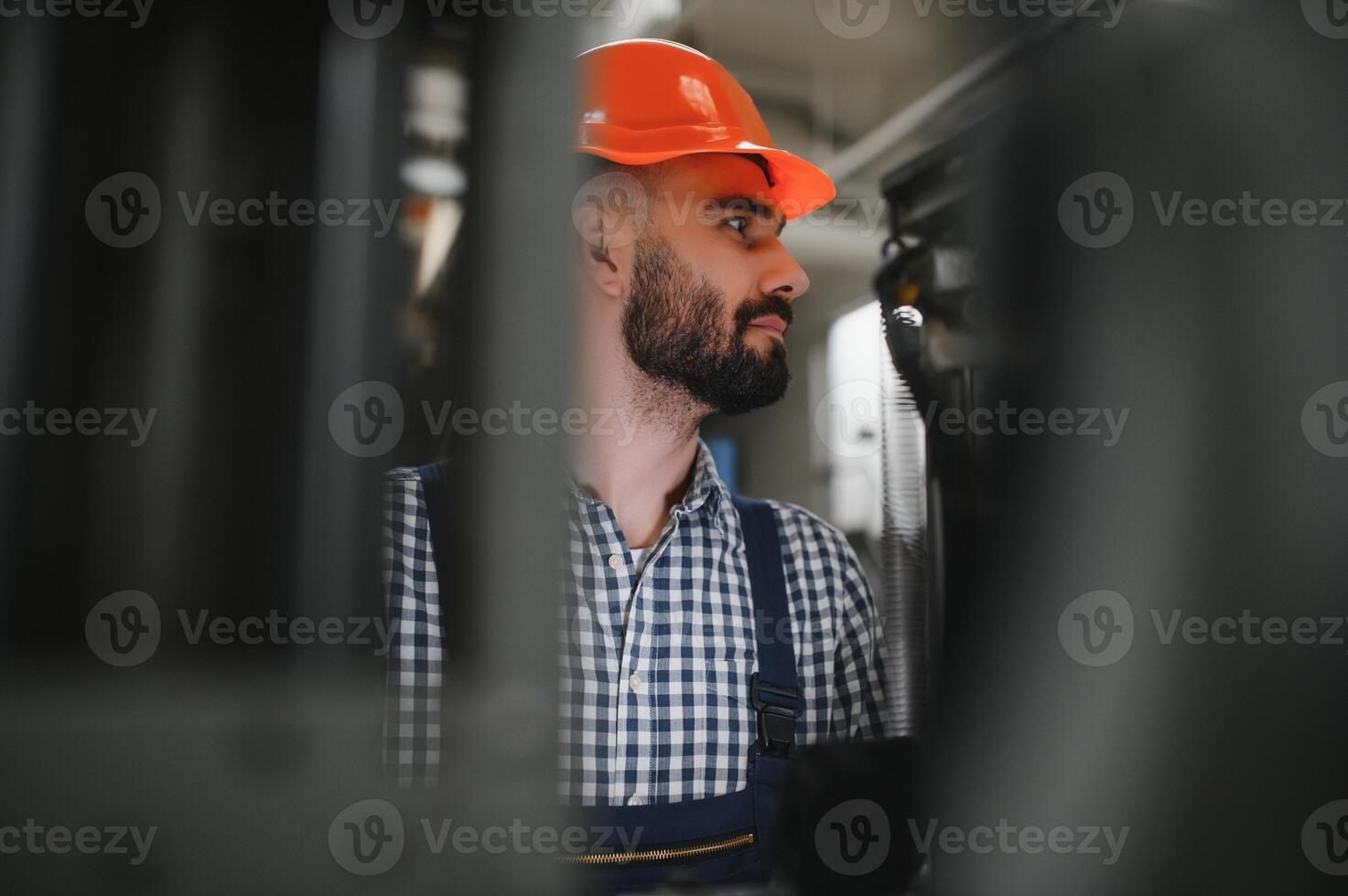 Factory worker. Man working on the production line. photo