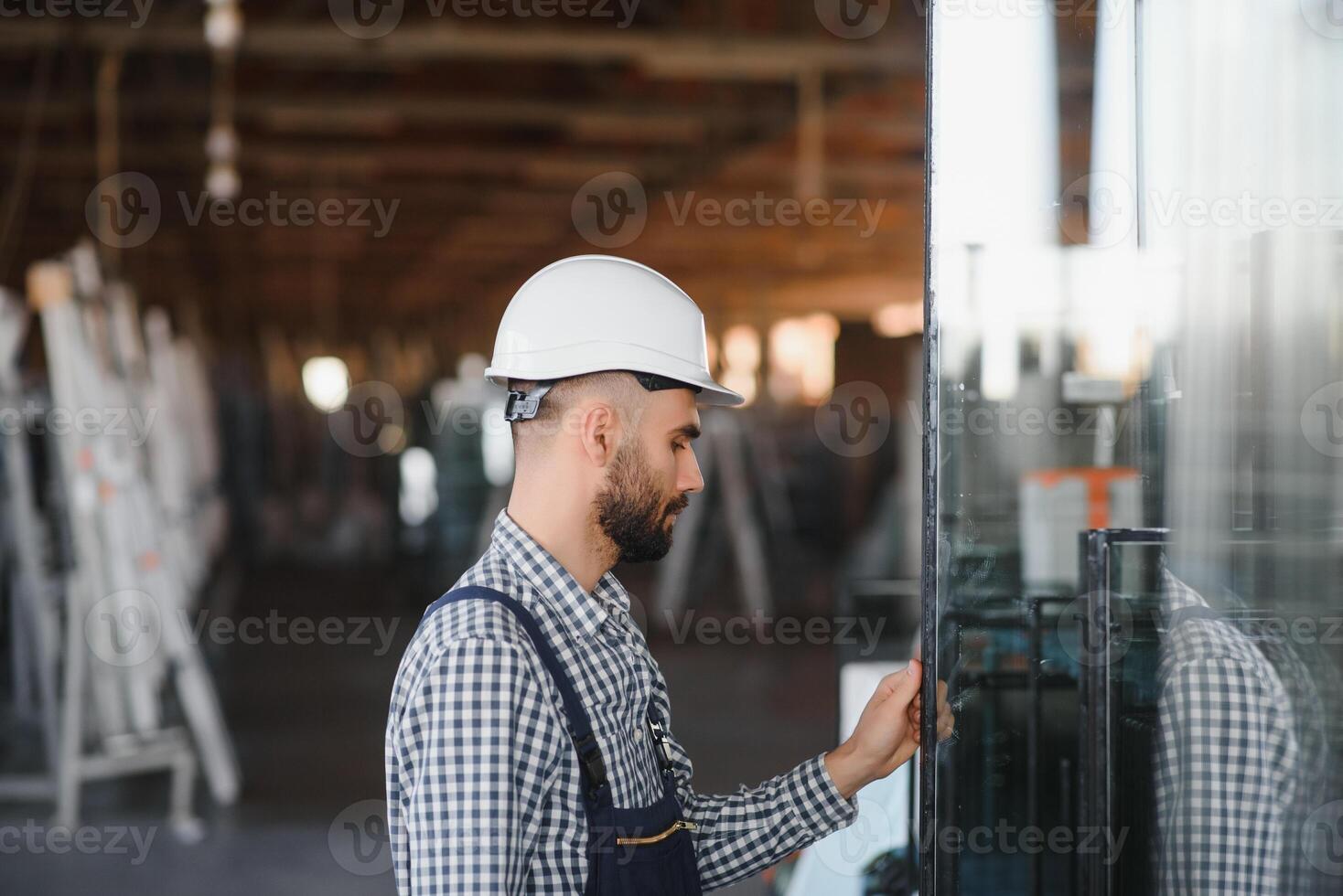 Factory worker. Man working on the production line. photo