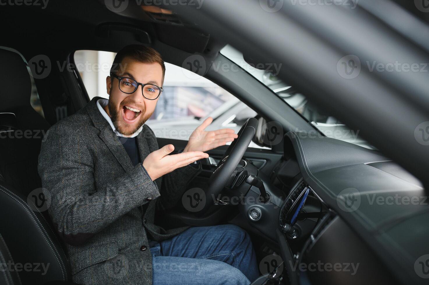 His true love. Portrait of a mature man smiling happily sitting in a brand new car photo