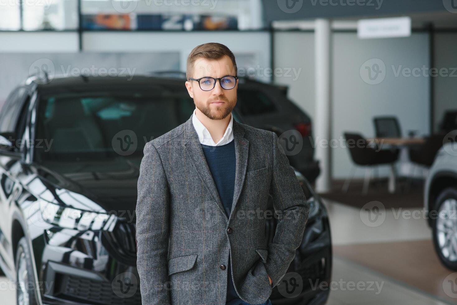 Man adult customer male buyer client wears classic suit white shirt chooses auto wants to buy new automobile touch check car in showroom vehicle salon dealership store motor show indoor. Sales concept photo