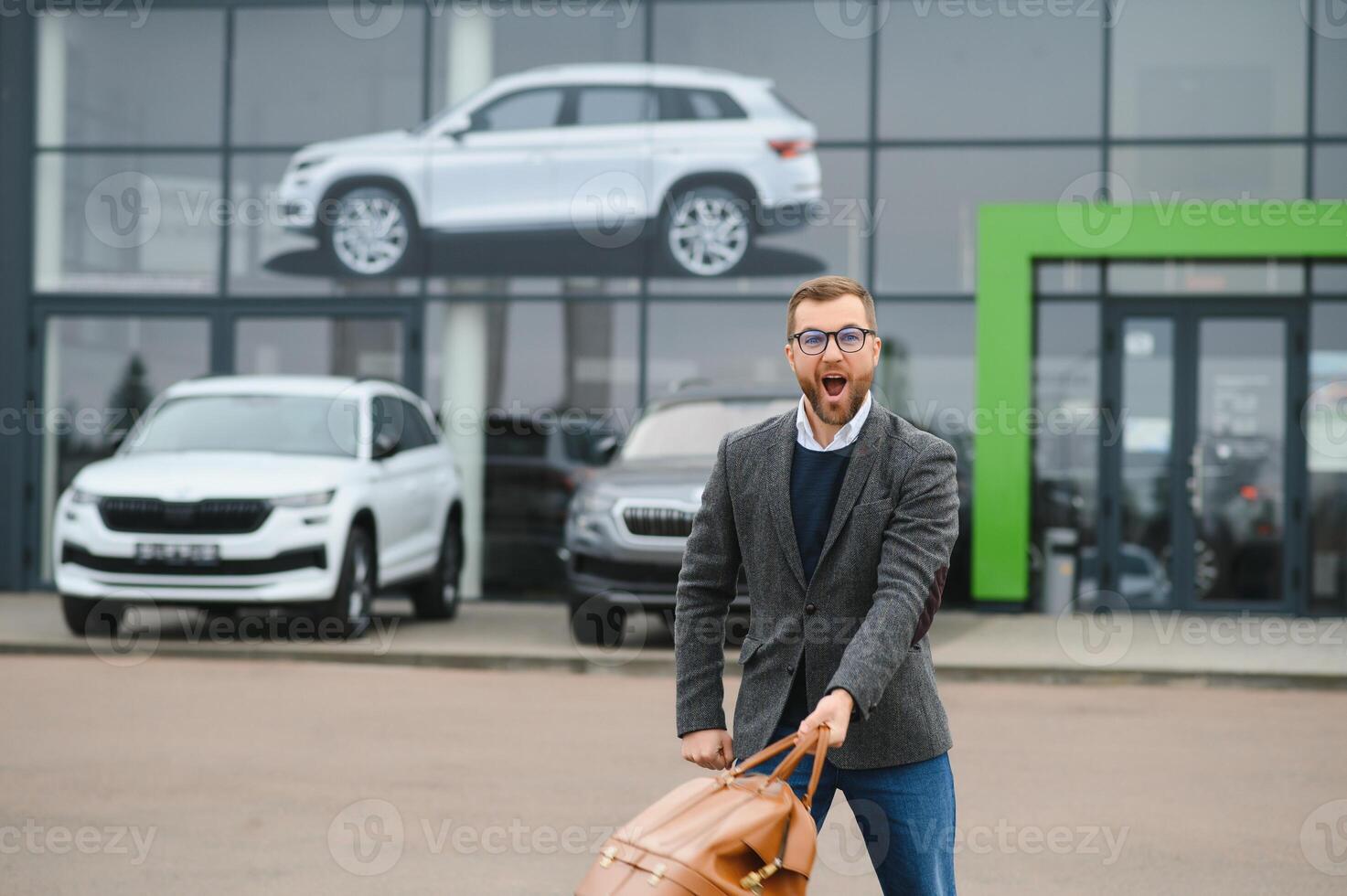 Portrait of happy customer buying new car. photo