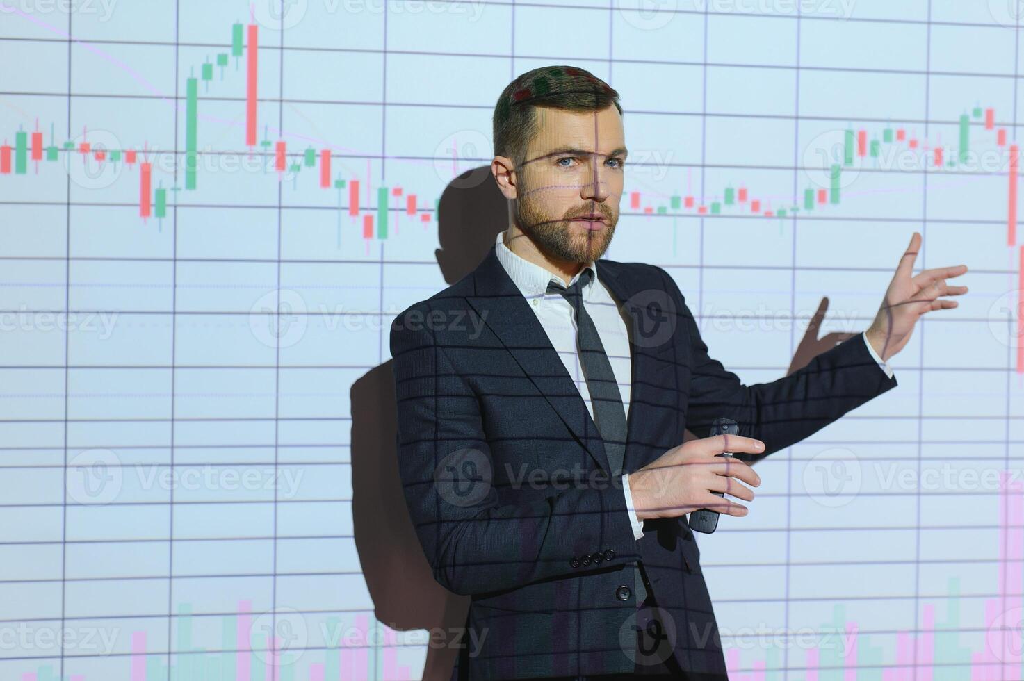 Portrait of concerned European businessman thinking in blurry office with double exposure of falling financial chart. Concept of crisis and stock market. photo