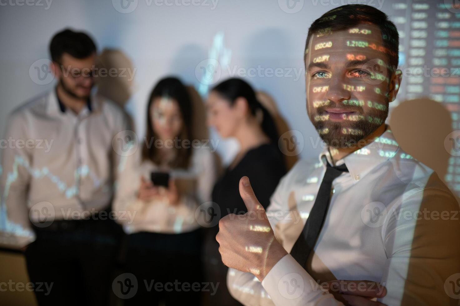 Group of business people working at modern office.Technical price graph, red and blue candlestick chart and stock trading computer screen background. Double exposure. Traders analyzing data photo