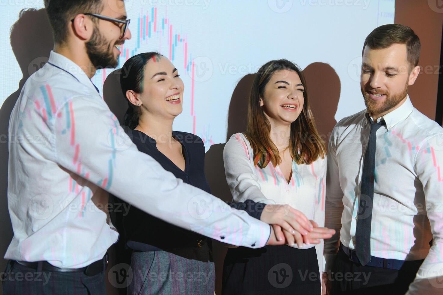 Group of business people working. Technical price graph and indicator, red and blue candlestick chart and stock trading computer screen background. Traders analyzing data photo