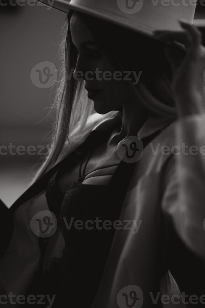 Portrait of a beautiful and sexy woman at home. photo