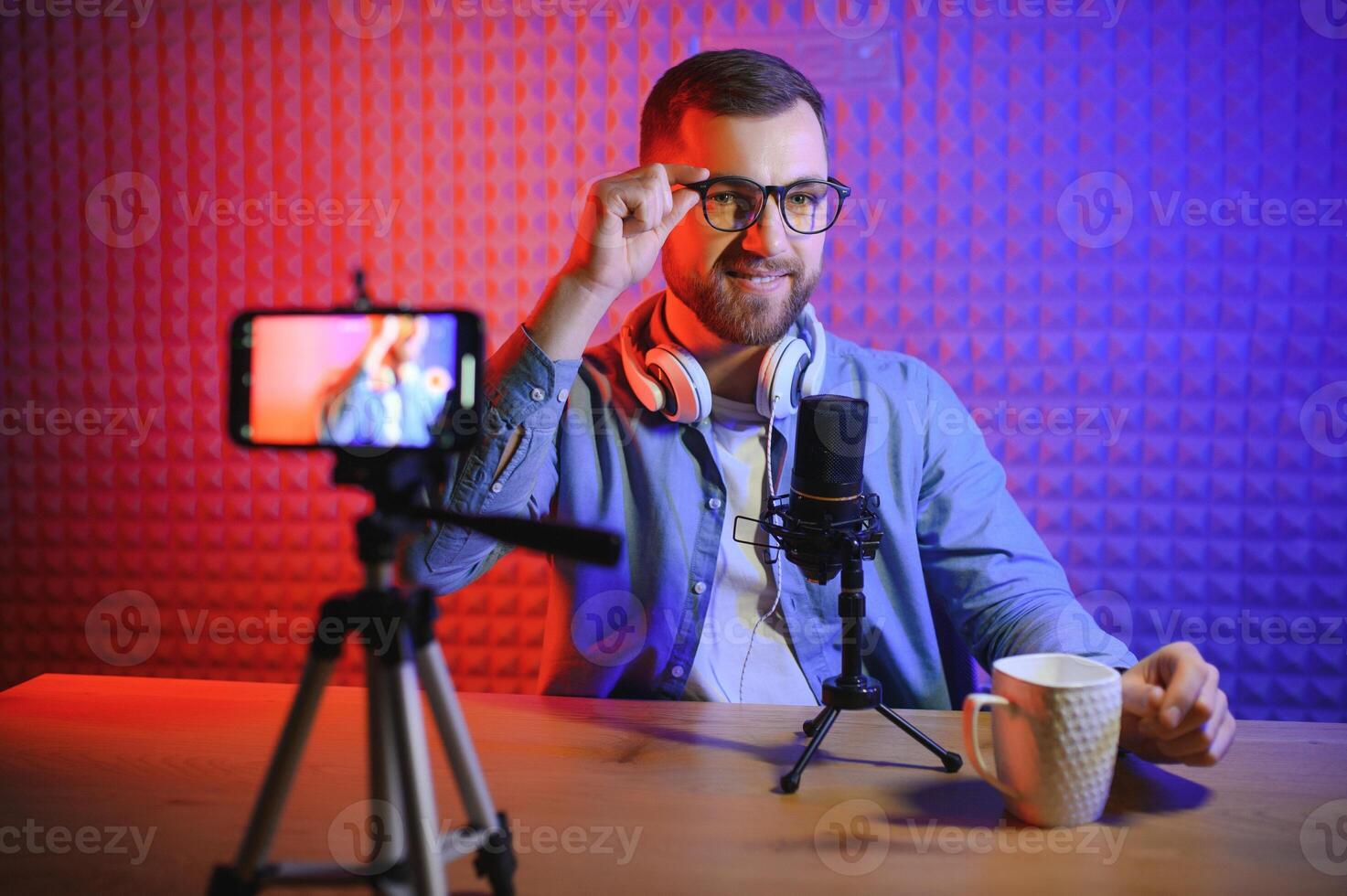 Young blogger with recording photo