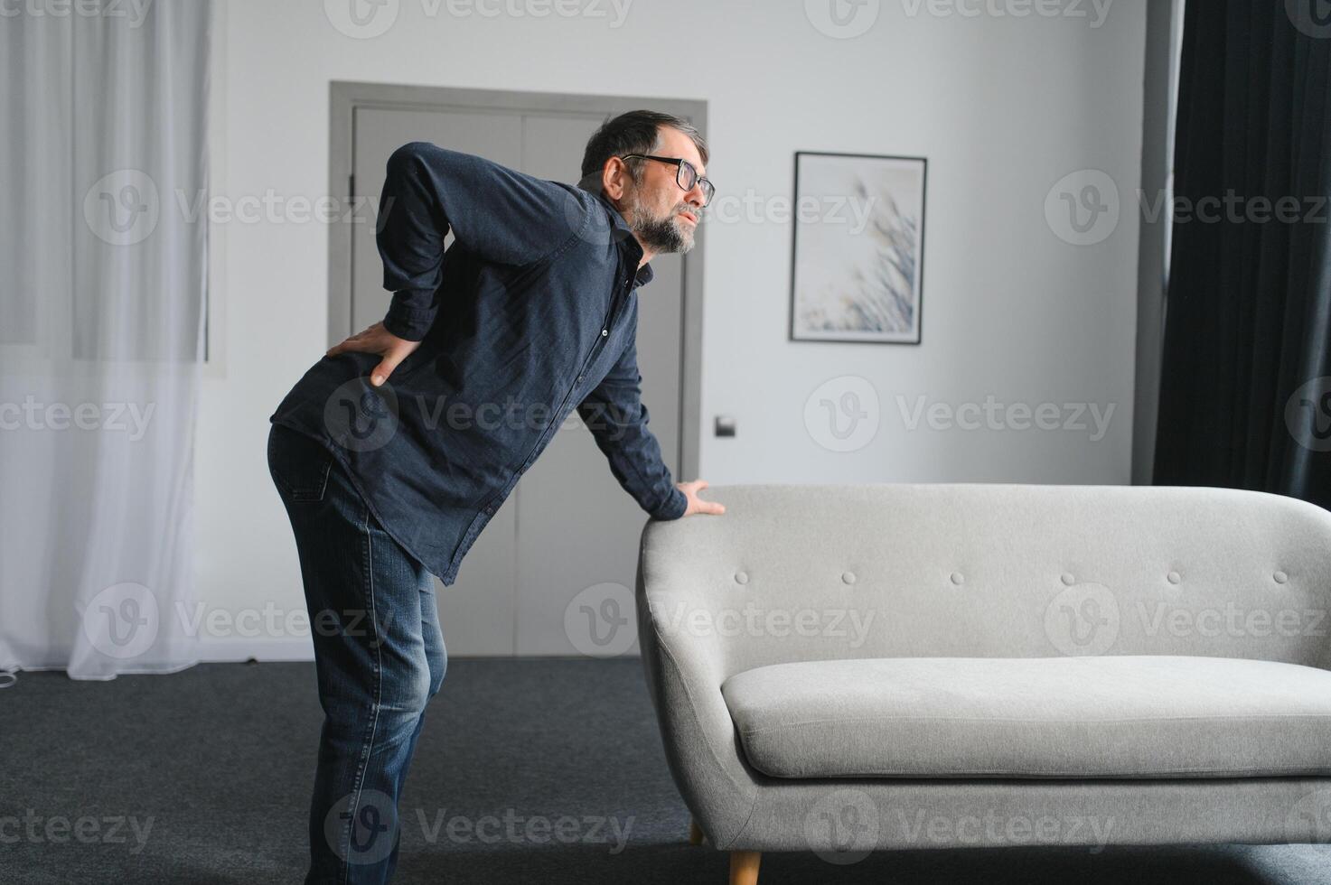 Elderly people with lower back pain photo
