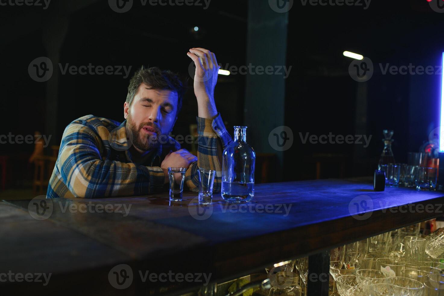 Young drunk man in bar photo