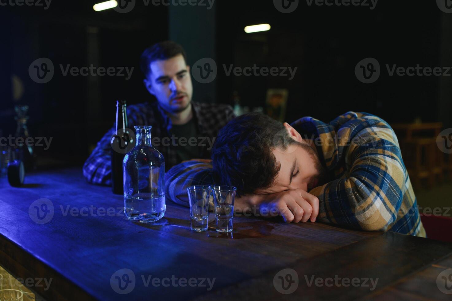 Young drunk man in bar photo