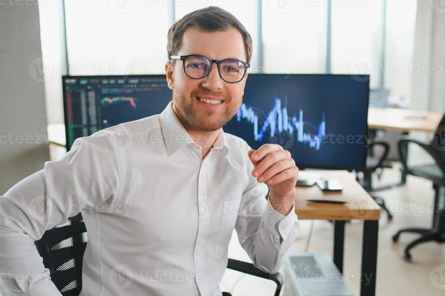 Successful trader in formalwear checking cryptocurrency information data on finance market graph, working in office photo