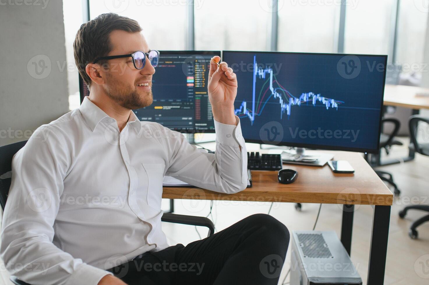 Successful trader in formalwear checking cryptocurrency information data on finance market graph, working in office photo