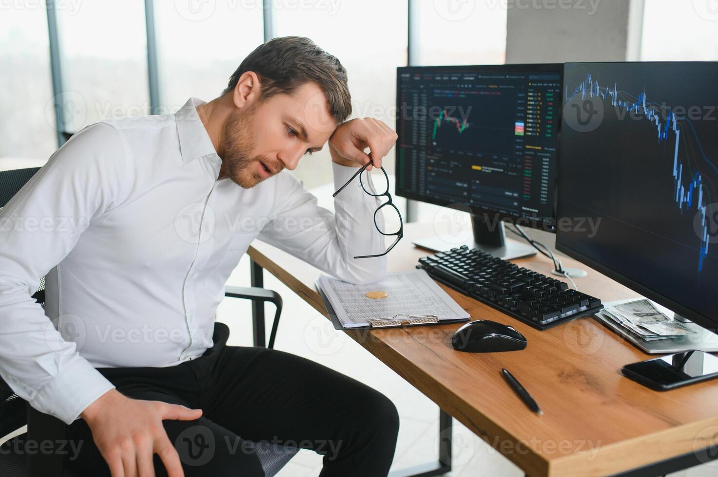 Serious business man trader analyst looking at computer monitor, investor broker analyzing indexes, financial chart trading online investment data on cryptocurrency stock market graph on pc screen. photo