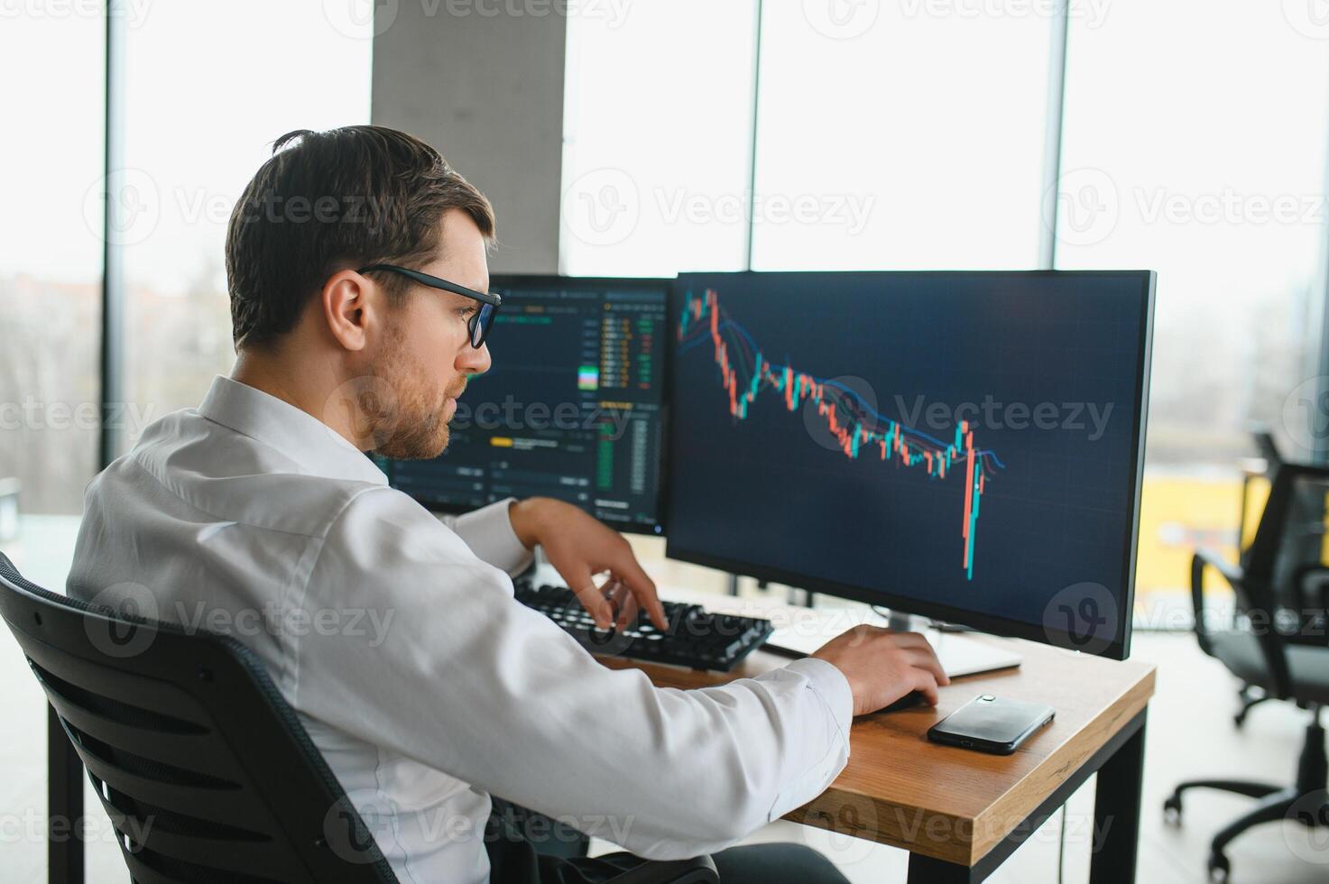 Successful trader in formalwear checking cryptocurrency information data on finance market graph, working in office photo