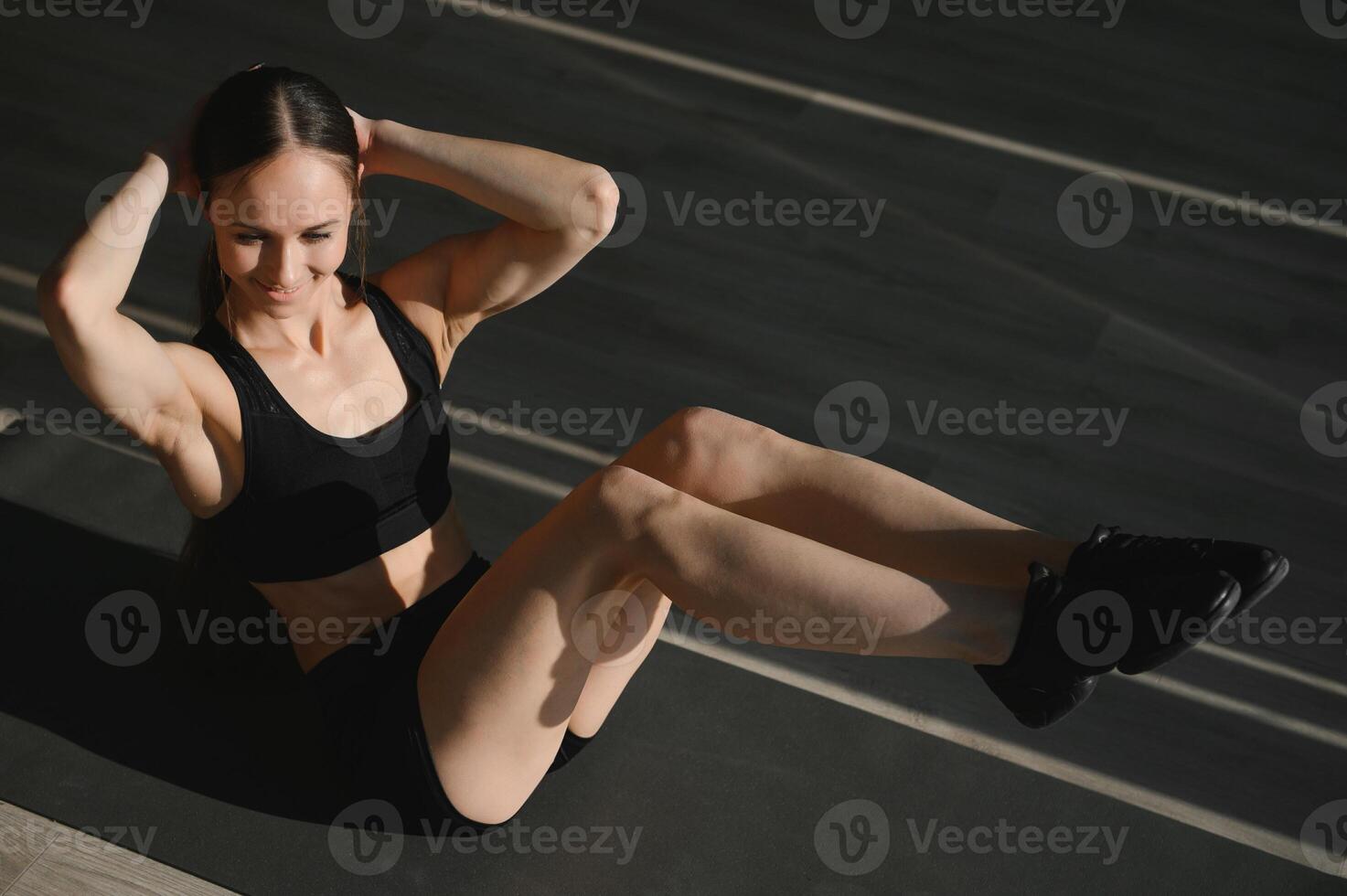 beautiful athletic woman working ab intervals in fitness photo