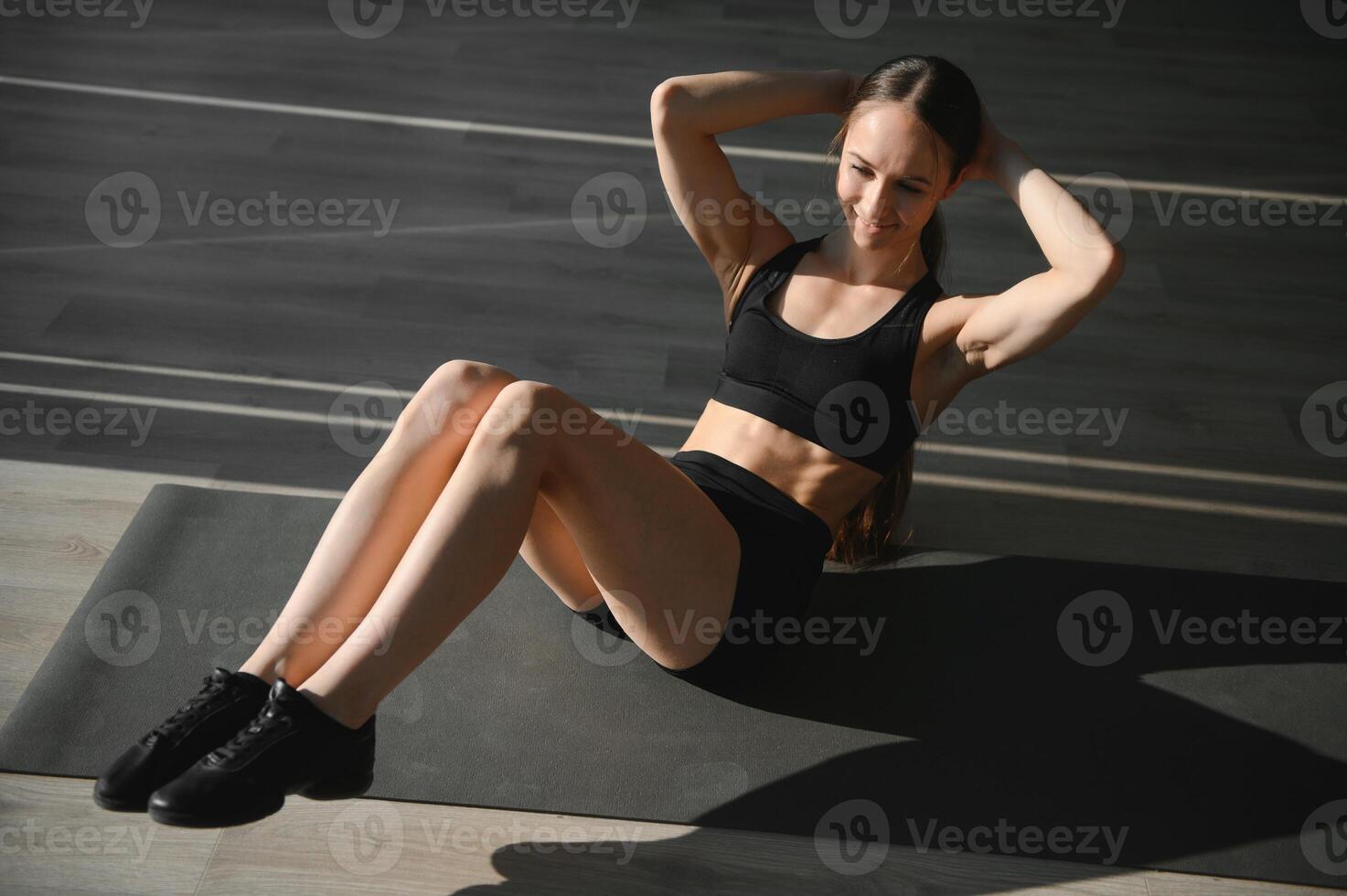 Close up image of attractive fit woman in gym. photo