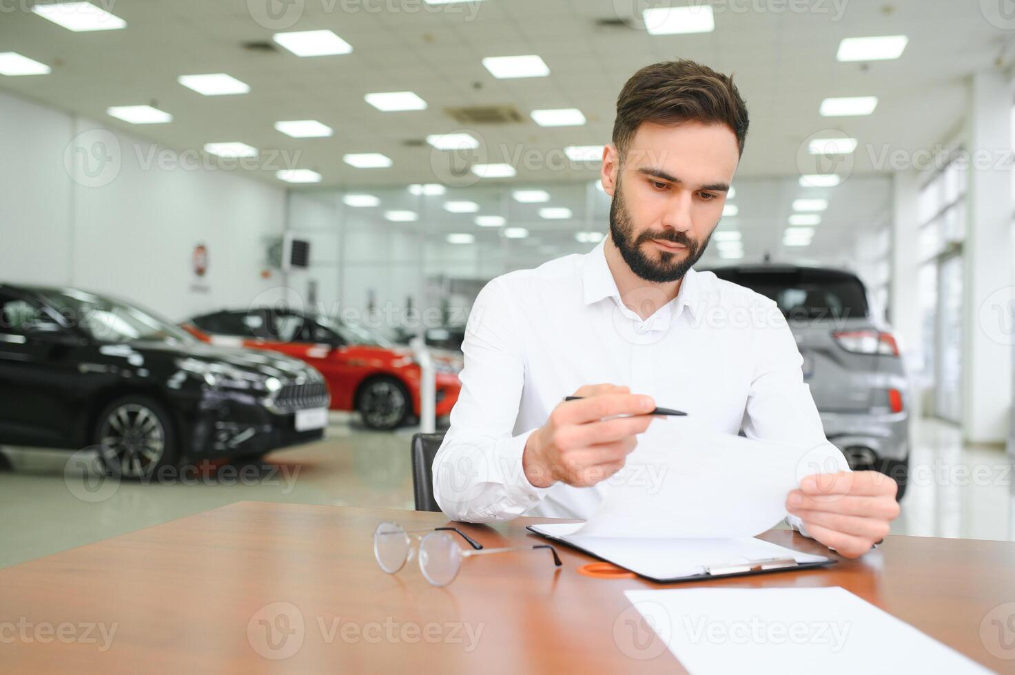I have a new car. client signing car lease form. photo
