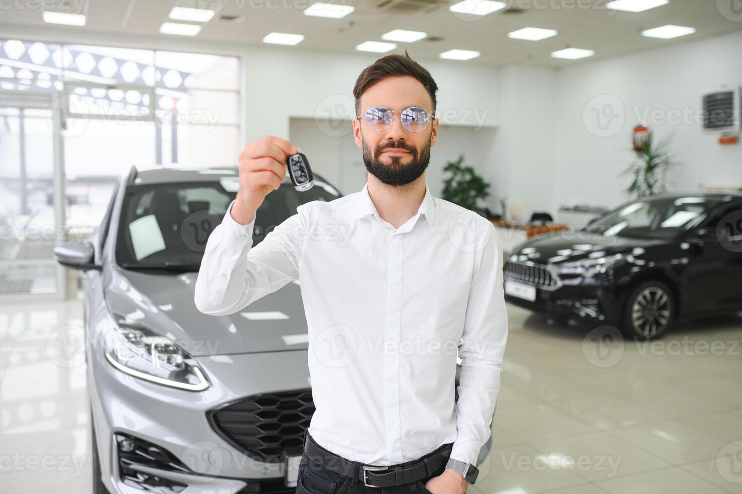 Man confident customer male buyer client wear white shirt choose auto want buy new automobile in showroom vehicle dealership store motor show indoor Sales concept. photo