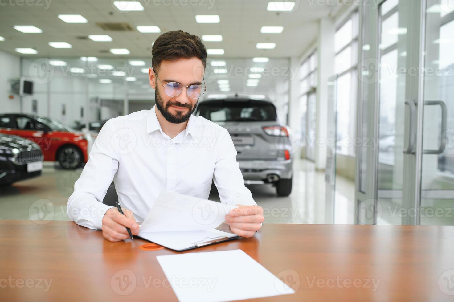 I have a new car. client signing car lease form. photo