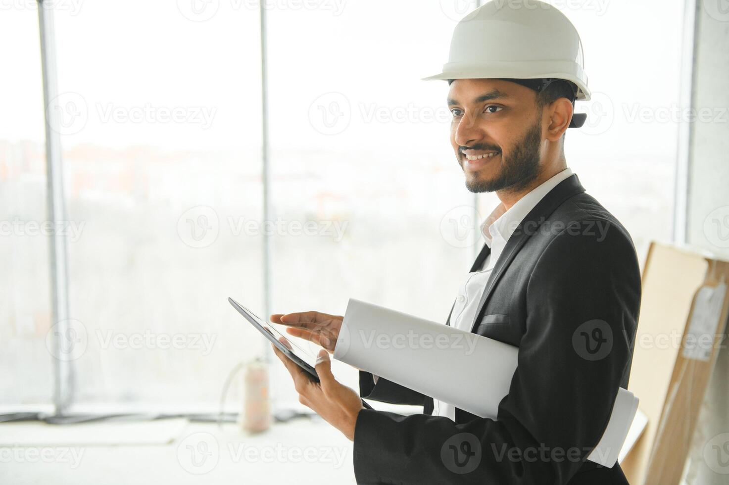 Portrait of a Indian engineer posing at the camera photo