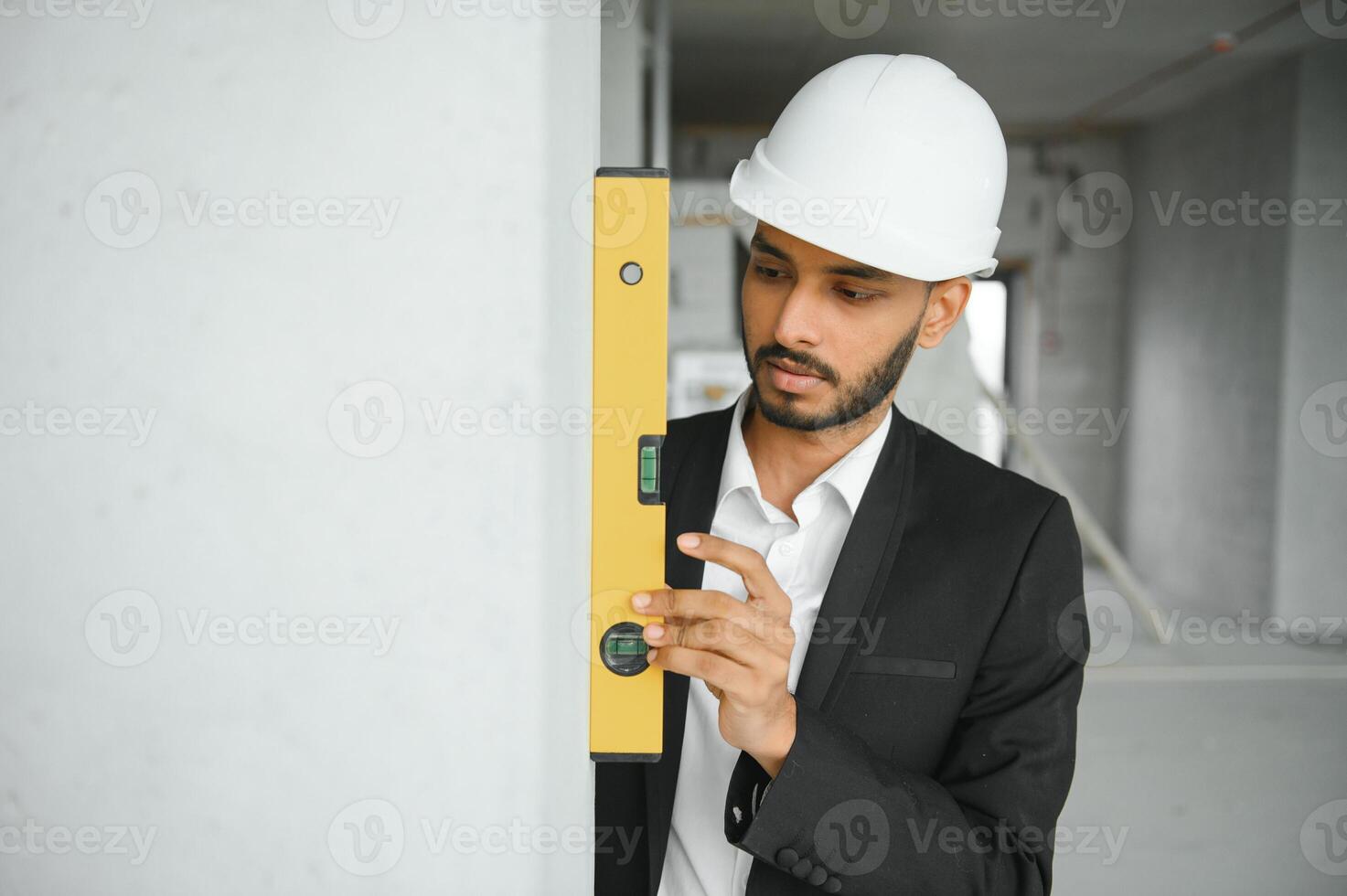 Portrait of a Indian engineer posing at the camera photo