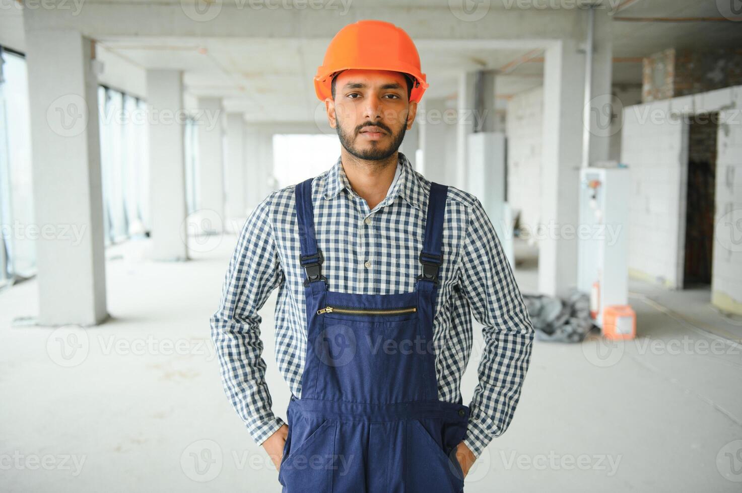 A migrant worker poses for a photo on a city centre construction site in Singapore. The SE Asian city state has a significant migrant worker population