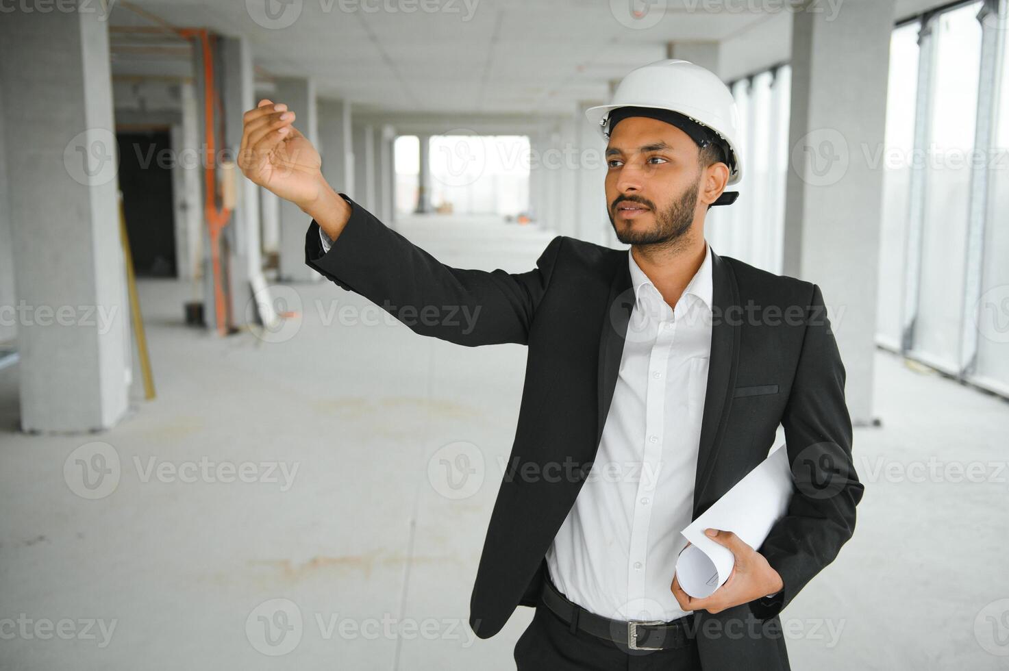 Portrait of a Indian engineer posing at the camera photo