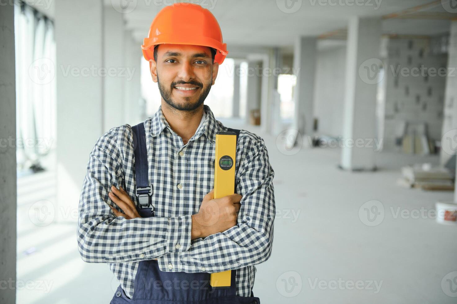 building, construction and people concept. Builder at construction photo
