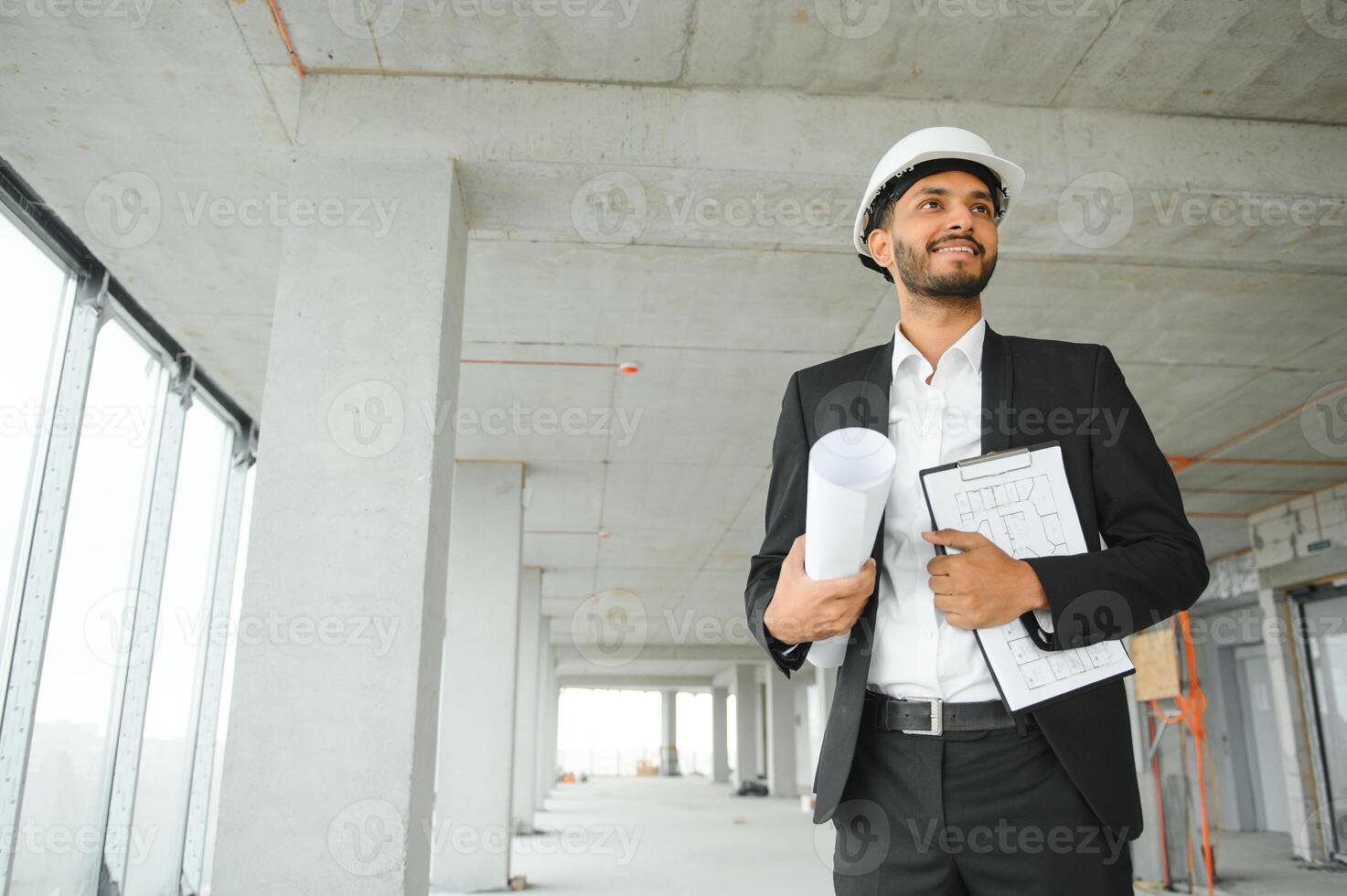Portrait of a Indian engineer posing at the camera photo