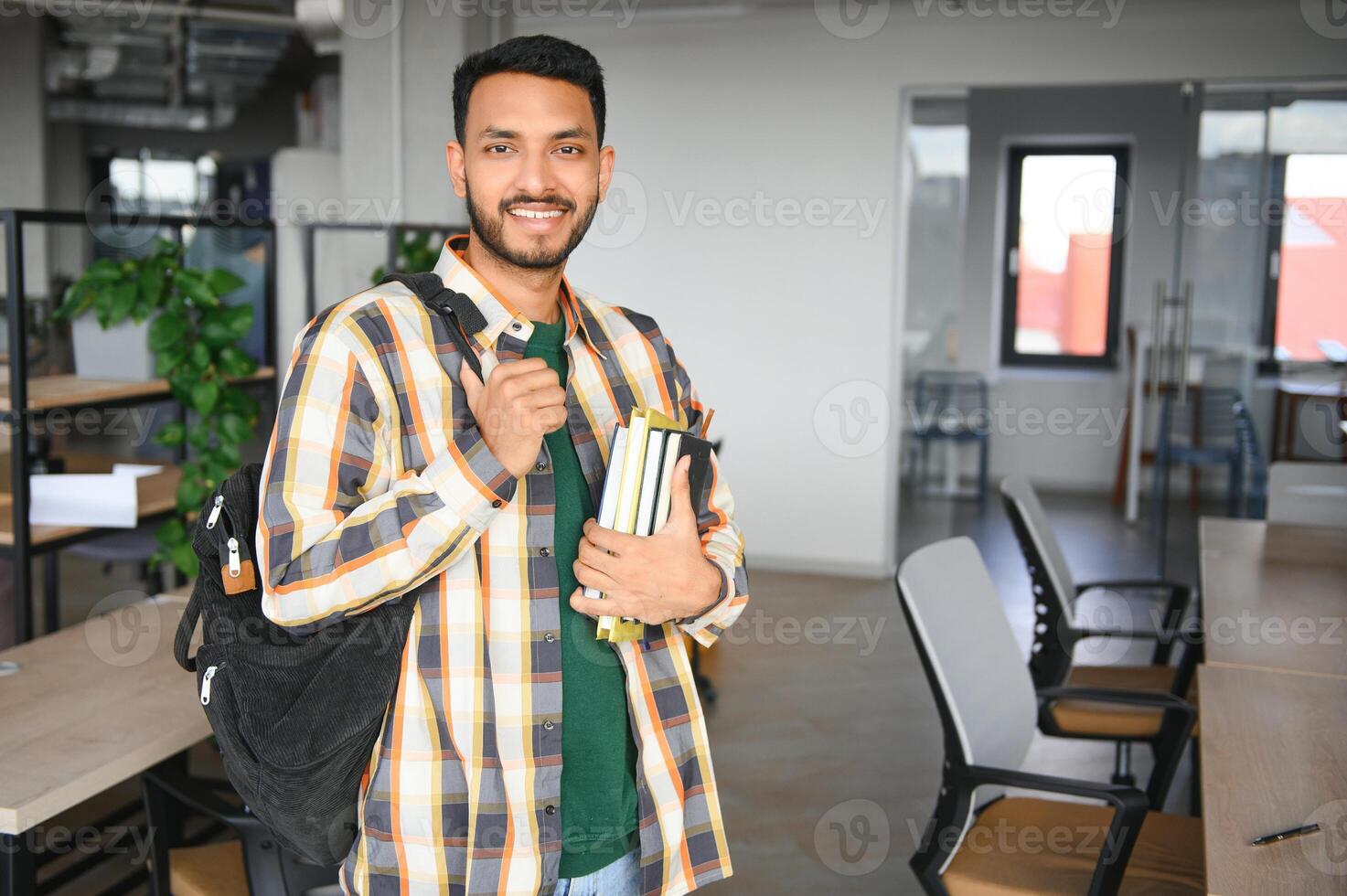 indian student with books at university photo