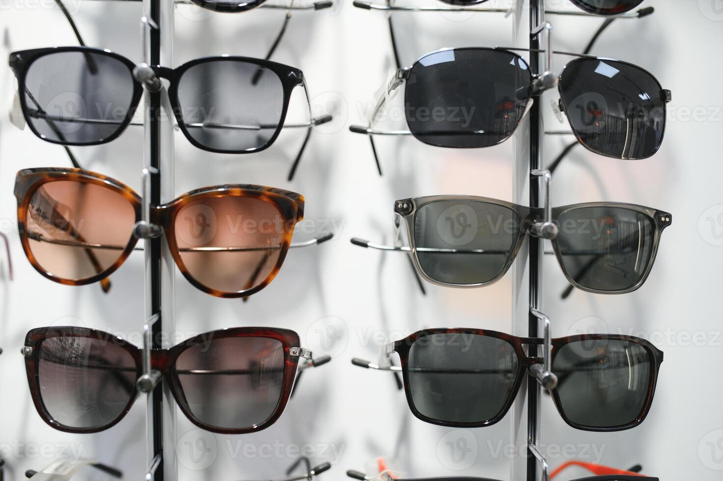 Stand with sunglasses. Sale the city market or in the store sunglasses. Trendy sunglasses, Summer eyeglasses, fashion collection, Different sunglasses on a stand photo