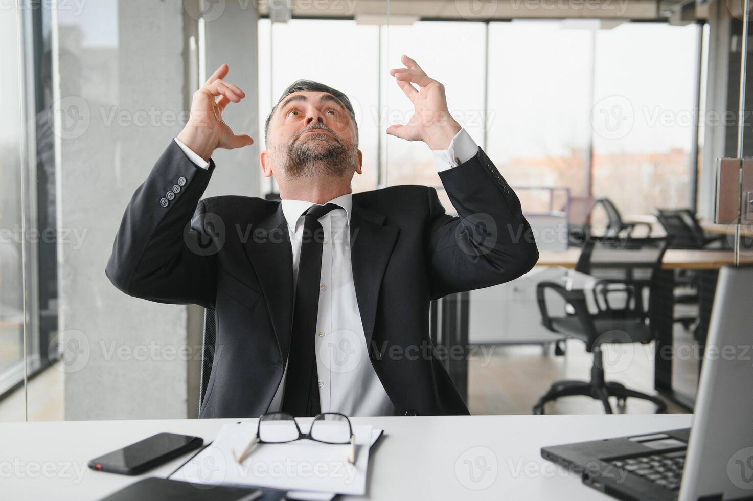 Angry businessman with document shouting at somebody photo