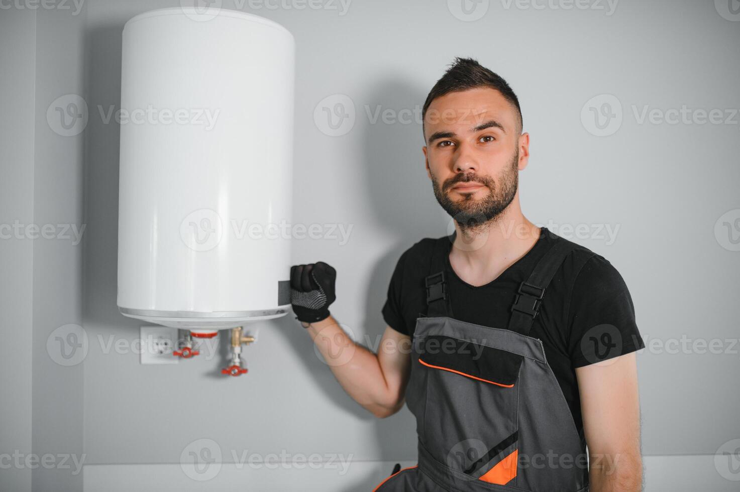 Professional plumber checking a boiler and pipes, boiler service concept photo