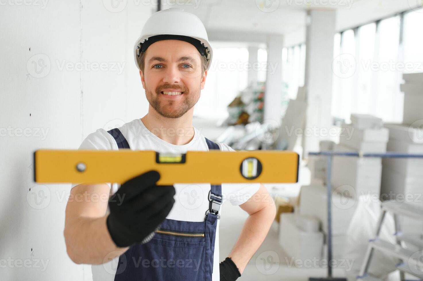 A happy worker proudly standing at his workplace. photo