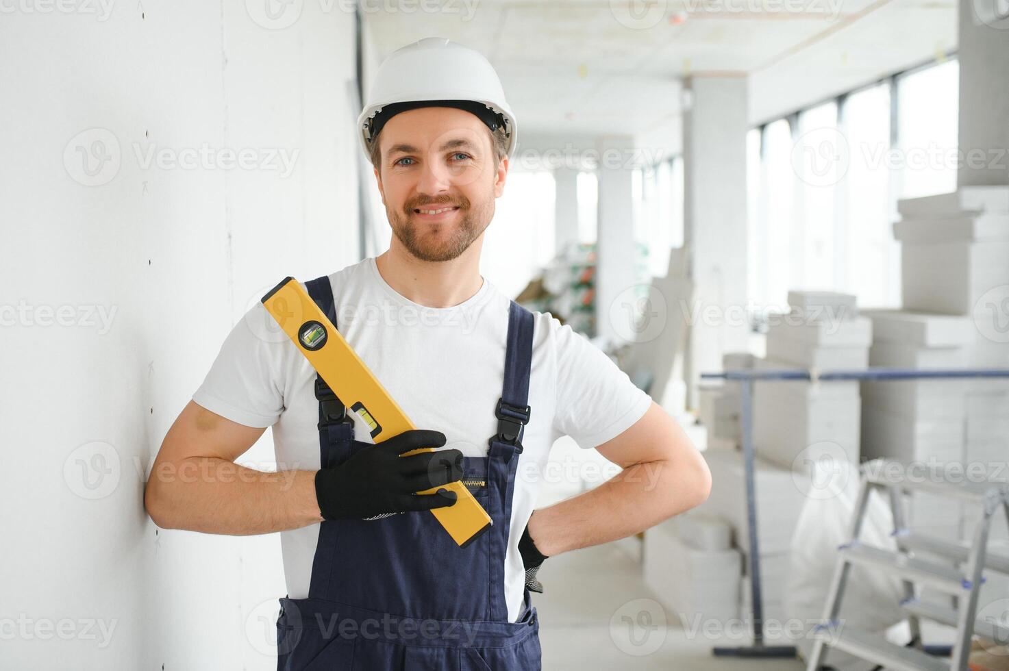 A happy worker proudly standing at his workplace. photo